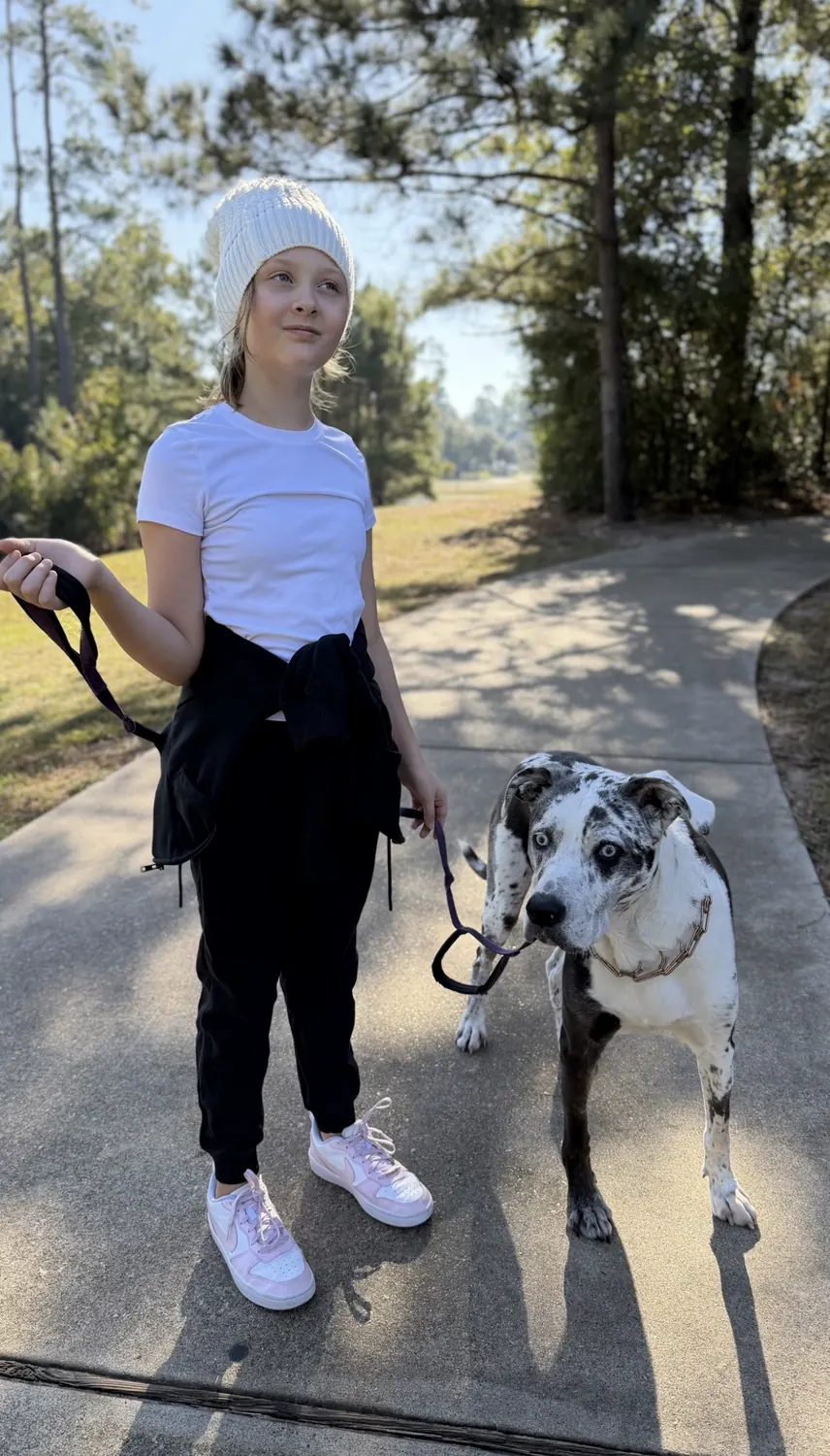 Emma outdoors with a dog